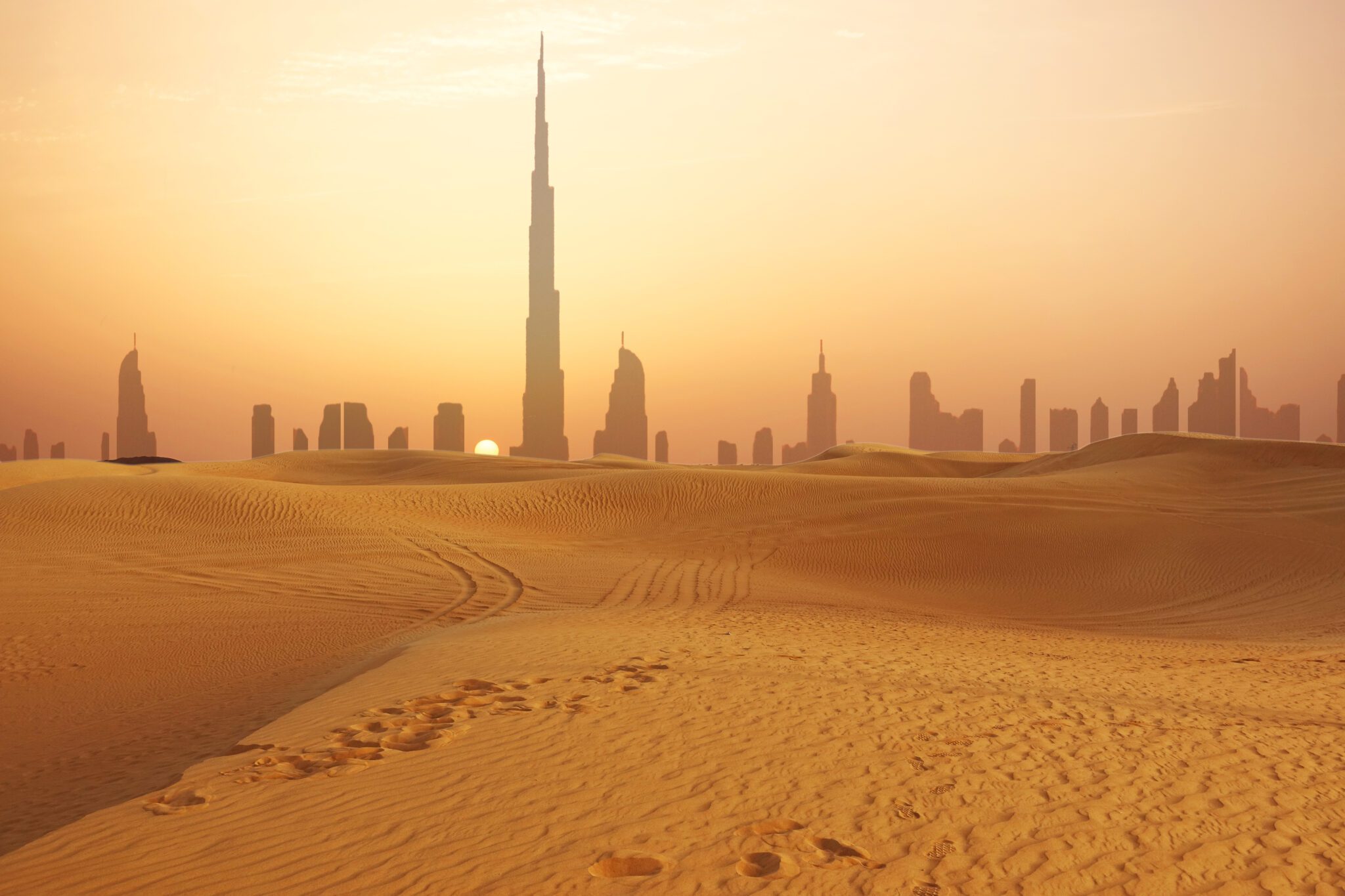 An image of Dubai with desert in the foreground.