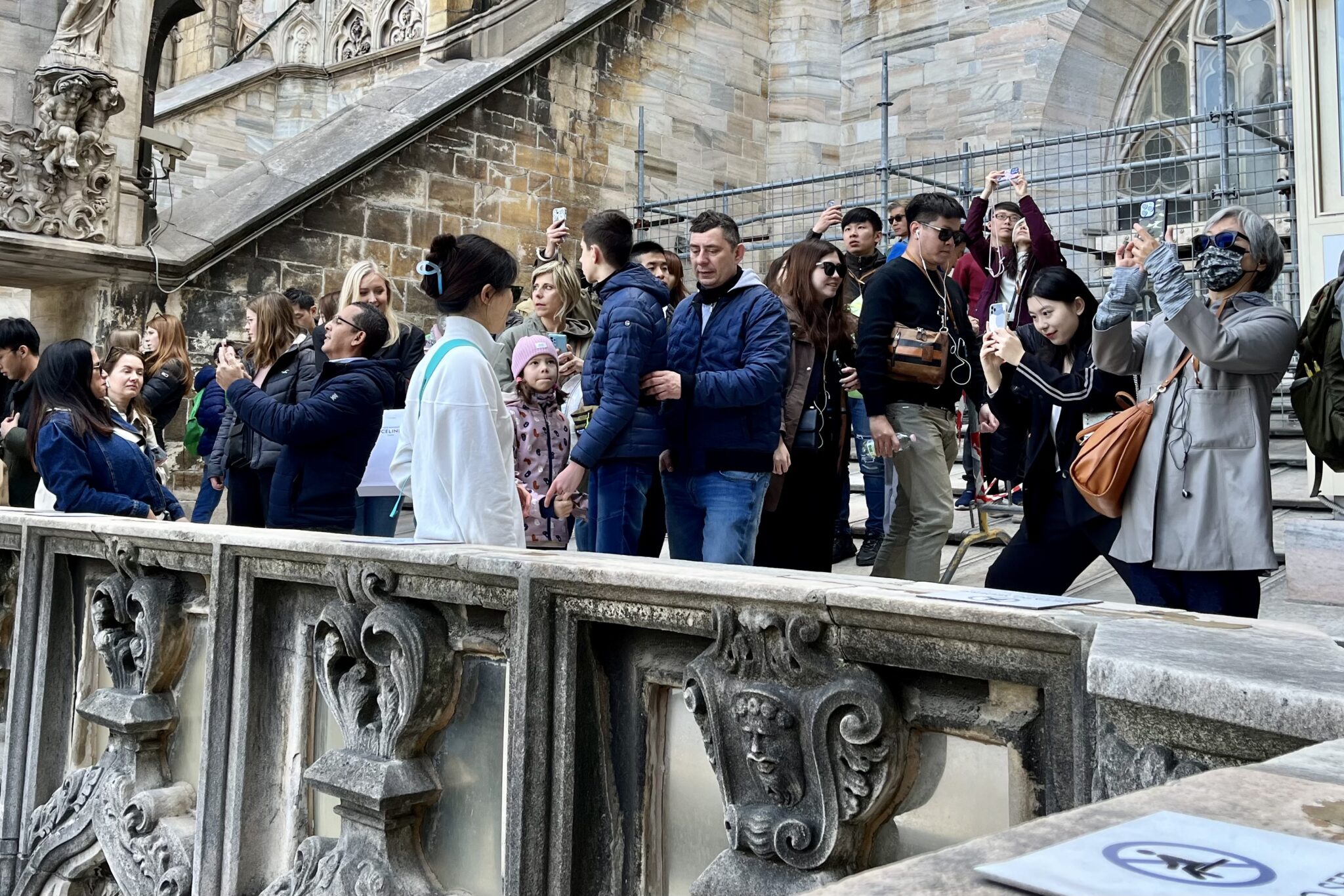 Tourists taking photos on the roof of Milan’s cathedral