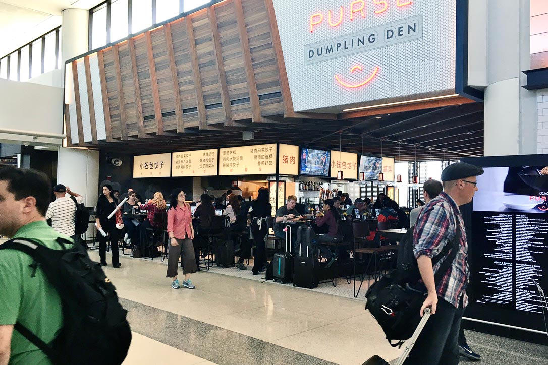 passengers wandering through an airport terminal