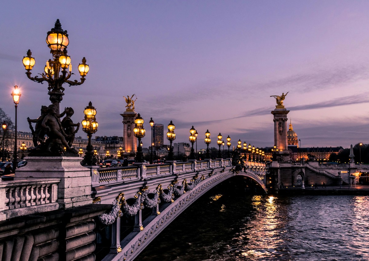 Ornate bridge with sunset over water